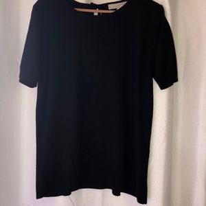 Black, short sleeved pullover; tie at back of neck